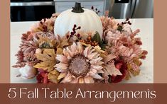 a white pumpkin sitting on top of a table