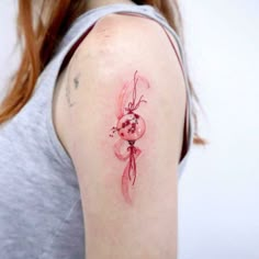 a woman with a tattoo on her arm