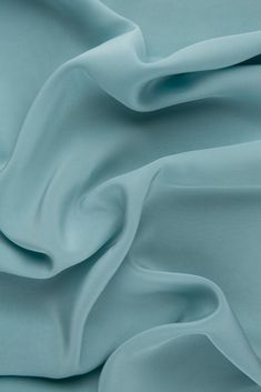 Crepe de Chine is a lightweight, soft, and subtly textured fabric perfect for evening-wear, bridal/wedding, high-end sportswear, and home decor. The Seafoam Silk Crepe de Chine Fabric is ideal for light blouses, scarves, dresses, and skirts; as well as making a great lining fabric. Crepe de Chine is mostly recognized by its visible and touchable texture. The fabric is very durable and moderately easy to sew. It's a perfect fabric for warm-weather garments, as the silk fibers have a natural absorbency and the slightly gauzy nature makes it very breathable. Fabric Weight: 16 MM The fabric is sold by the Yard, and measures 44 inches in width. Dupioni Silk, Easy To Sew, Organza Fabric, Silk Wool, Silk Crepe, Textured Fabric, Wool Fabric, Fabric Swatches, Lining Fabric