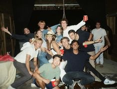 a group of young men and women posing for a photo