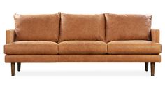 a brown leather couch sitting on top of a wooden frame