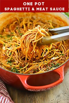 one pot spaghetti and meat sauce in a red pan with a spatula on top