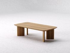 a wooden table sitting on top of a white floor