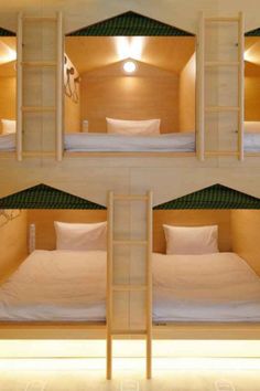 bunk beds are arranged in the shape of three pyramids, each with their own ladder