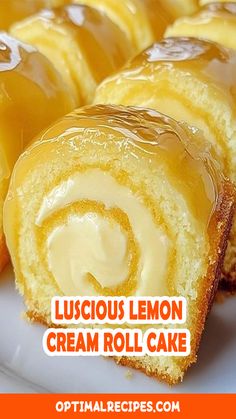 a close up of a pastry on a plate with the words luscious lemon cream roll cake