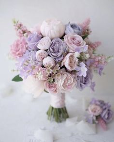 a bouquet of flowers sitting on top of a table