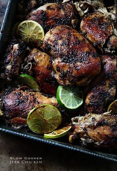 grilled chicken with lemons and limes in a pan