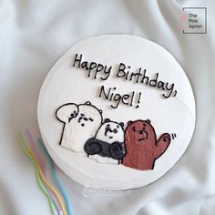 a birthday cake with three bears on it and the words happy birthday, nigel