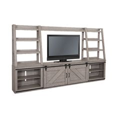 the entertainment center is made out of wood and has sliding doors on both sides, with a television mounted to it's side