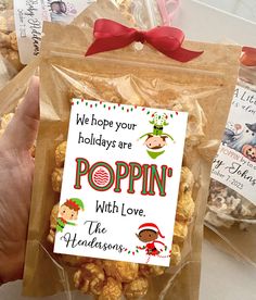 there is a bag of popcorn with the message we hope your holidays are poppin'with love