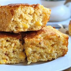 several pieces of cornbread on a white plate