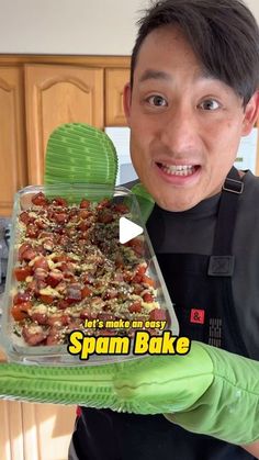 a man holding up a baking dish in his hands with the words spam bake on it