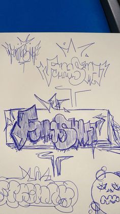 some graffiti writing on a piece of paper