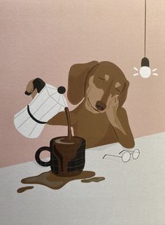 a brown dog laying on top of a table next to a cup