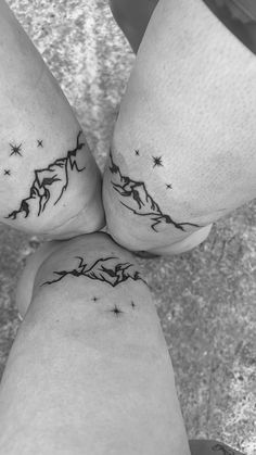 two people with matching tattoos on their legs