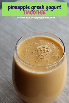 a smoothie in a glass on a table with the text pineapple greek yogurt smoothie