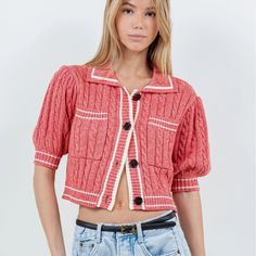 Elevate your casual look with our Cardigan Tee, a cropped knit tee in a trendy reddish-pink hue. Perfect for those preppy yet laid-back spring and summer days. Material & Care: Crafted from 60% cotton and 40% acrylic. Hand wash in cold water with mild detergent. Avoid wringing or twisting. Lay flat to dry away from direct sunlight. If needed, use a cool iron. Size & Fit: Model is 5'9 wearing size small Trendy Short Sleeve Sweater For Day Out, Trendy Cropped Summer Cardigan, Casual Pink Cropped Knit Sweater, Casual Cropped Sweater For Summer, Casual Pink Cropped Sweater, Casual Pink Knit Cropped Sweater, Pink Cropped Cardigan For Spring, Trendy Knit Cropped Sweater For Summer, Trendy Short Sleeve Cotton Cardigan