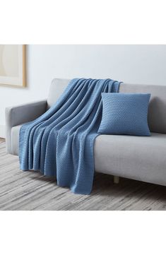 a couch with a blue blanket on it