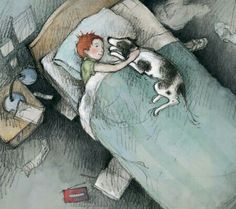 a child laying in bed with a cat and dog on top of the bed next to him