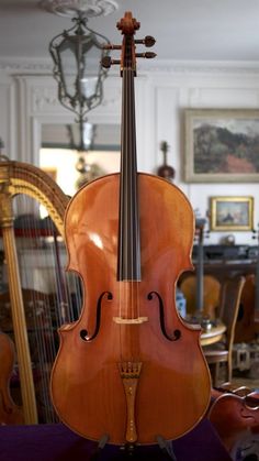 an old violin sitting on top of a table