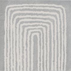 an area rug with white and grey stripes