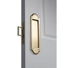 an open door with a brass handle on the front and side doors, which are closed