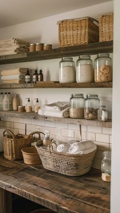 the shelves are filled with baskets, jars and other items on top of wooden boards