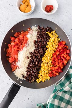 the ingredients to make mexican rice and beans in a skillet