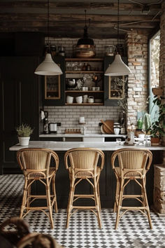 three wicker chairs sitting in front of a kitchen counter