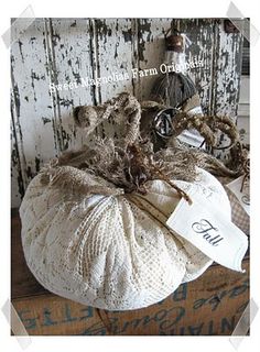 a white pumpkin sitting on top of a wooden table