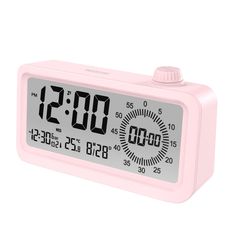 a pink alarm clock with the time at 11 30 pm on it's display