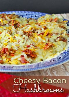 cheesy bacon hashbrowns casserole in a blue and white dish