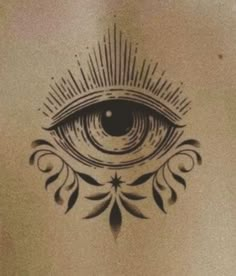 an all seeing eye tattoo on the back of a man's chest