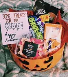 a halloween treat basket with candy, candies and treats in it that says some treats for my buddy happy halloween