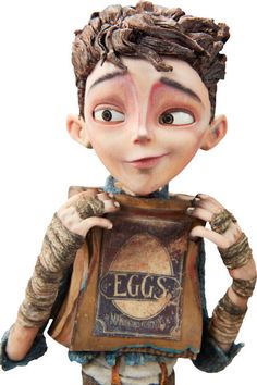 an egg boy figurine is holding up a box with eggs on it's chest