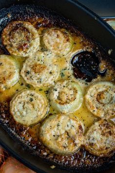 a skillet filled with food sitting on top of a stove