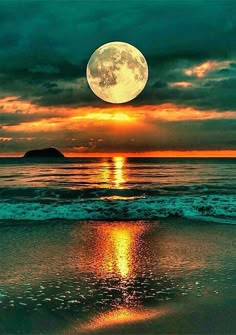 a full moon is seen over the ocean at sunset with waves crashing on the shore