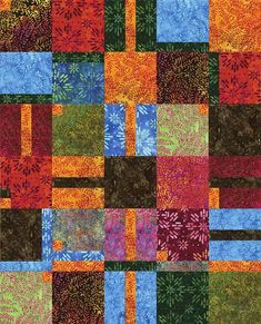 a colorful patchwork quilt with many different colors