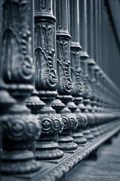 the railings are made of metal and have intricate designs