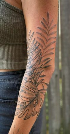 a woman with a tattoo on her arm