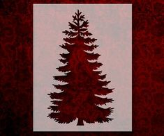 the silhouette of a pine tree against a red background