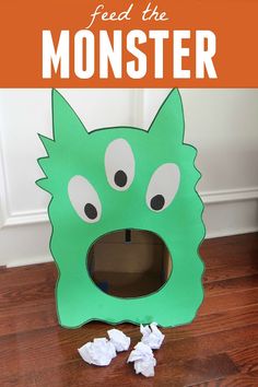 a monster made out of toilet paper with the words feed the monster on it