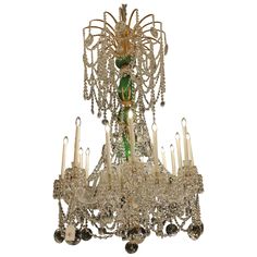 a chandelier with many candles hanging from it