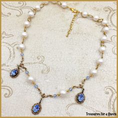 Feminine Victorian style meets elegant Regency glamour with a dash of Bridgerton inspiration in this beautiful Swarovski Crystal Elements Sapphire Blue Crystal and Pearl choker necklace.   *This necklace will be made just for you, Please allow 3-5 business days to ship. This elegant necklace is made with 8mm glass pearls in a light blush pink color connected with antique gold colored textured over links. The center of the necklace features 3 8x6mm Swarovski Crystal Elements faceted stones in a light Sapphire blue color. Each stone is in a prong brass setting that has been set in a Victorian style lace bezel setting and dangles from an antique gold colored connector. Small matching light Sapphire blue crystal beads brings all the element together. A truly beautiful necklace for a truly beau Elegant Blue Choker For Wedding, Elegant Blue Beaded Choker, Elegant Blue Choker For Formal Events, Regency Era Jewelry, Bridgerton Jewelry, Keychain Designs, Business Jewelry, Jewelry Sapphire, Light Blush Pink