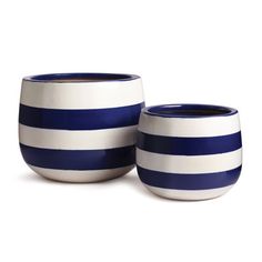 two blue and white striped cups sitting next to each other