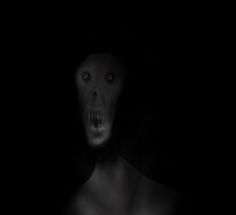 a creepy man in the dark with his mouth open