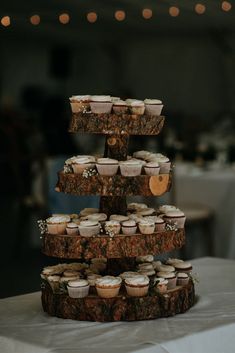 cupcakes are stacked on top of each other in the shape of a tree