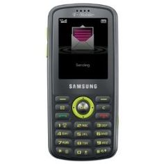 an old cell phone with the message samsung on it's screen and green buttons