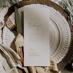 a table setting with napkins, silverware and a thank you card on it