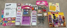 the contents of a barbie doll's play house laid out on the floor next to each other